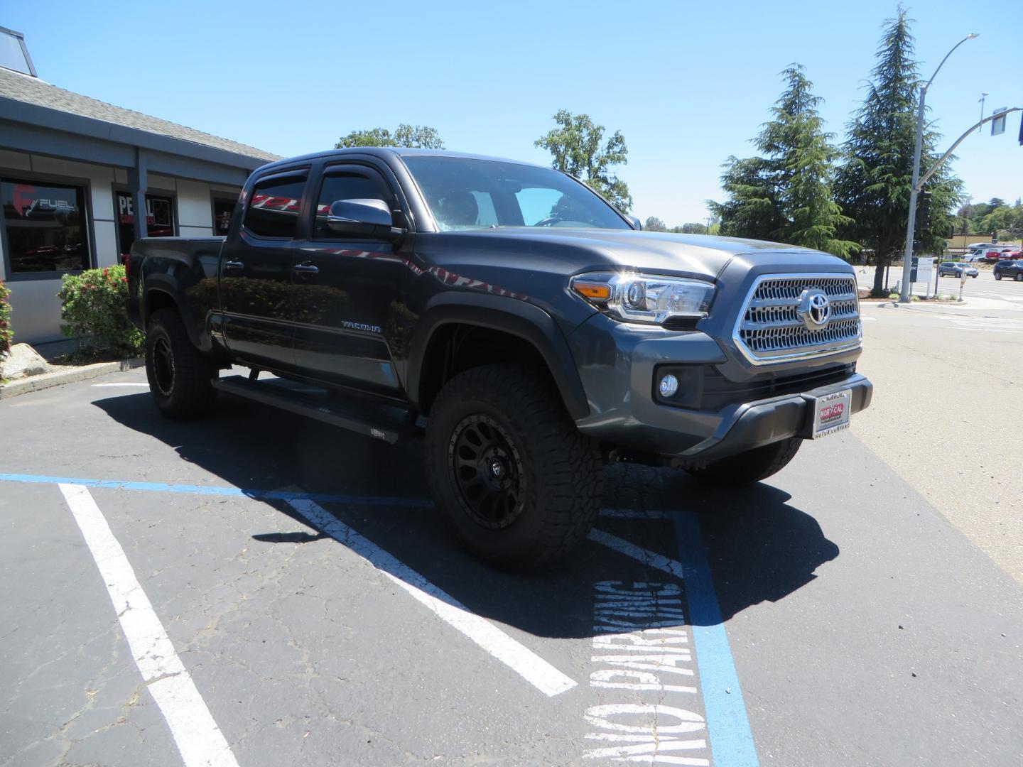 2017 CHARCOAL /GREY Toyota Tacoma TRD OFF-ROAD Double Cab Long Bed V6 6AT 4WD (3TMDZ5BN3HM) with an 3.5L V6 engine, automatic transmission, located at 2630 Grass Valley Highway, Auburn, CA, 95603, (530) 508-5100, 38.937893, -121.095482 - TRD Off-road Tacoma with a level kit, 17" Fuel Vector wheels, Falken Wildpeak AT tires, N-Fab running boards, Roll Up tonneau cover, BedRug, and window Deflectors. - Photo#2